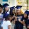 a group of people smiling with graduation caps on