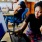 two people looking at a computer on a desk