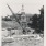 oil well with a house in the background